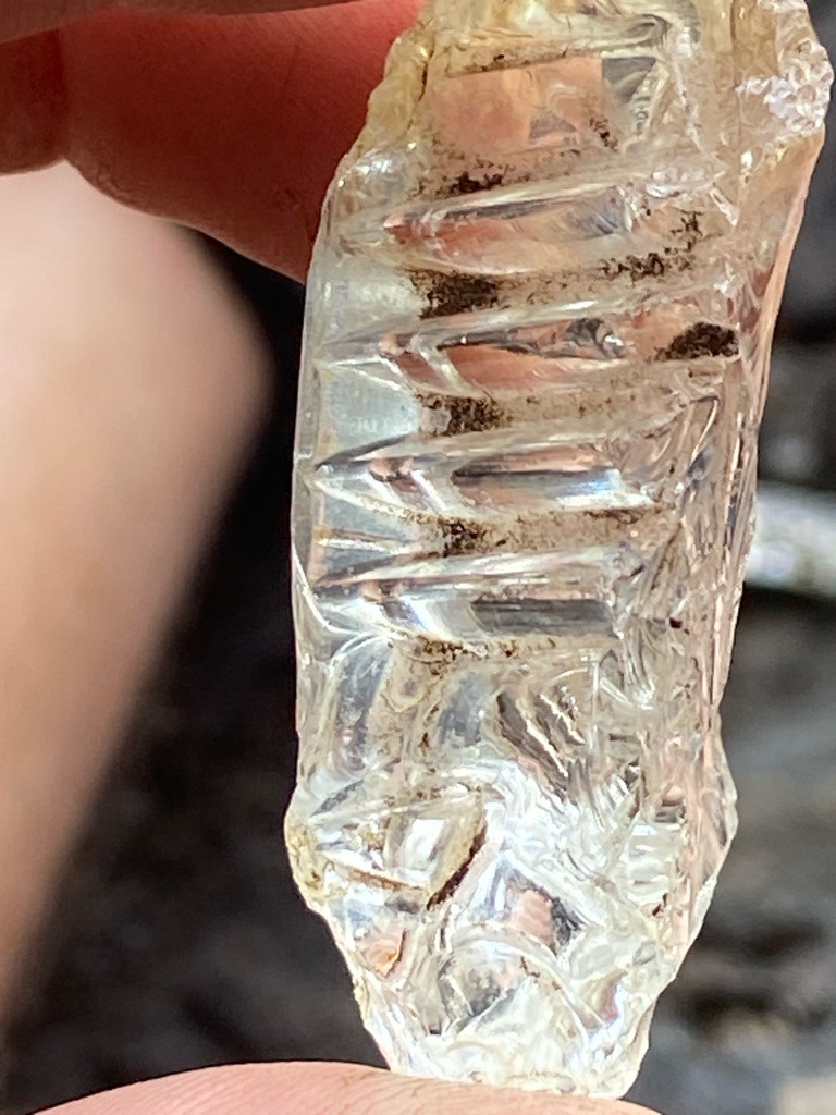 Natural quartz or modified crystal rather than a genuine diamond, exhibiting unique carved geometric patterns. - Irregular elongated crystal fragment with custom carved step-like facets.