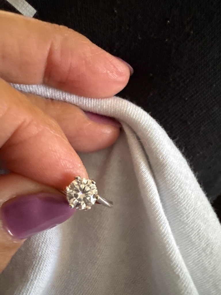 Natural or Lab-Grown Diamond (Visual inspection cannot definitively distinguish between natural and lab-grown without advanced testing like spectroscopy) - Round Brilliant