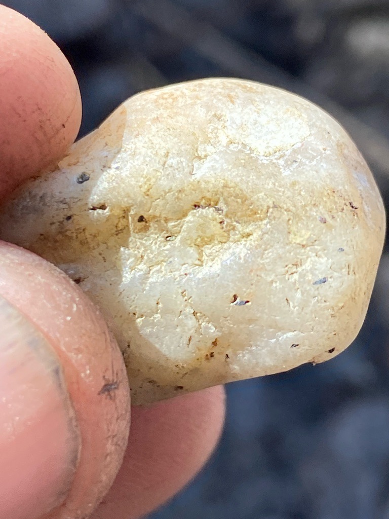 Not a diamond; appears to be quartz, quartzite, or a river-worn pebble (silicate mineral) - Irregular, rounded pebble or water-worn raw mineral shape