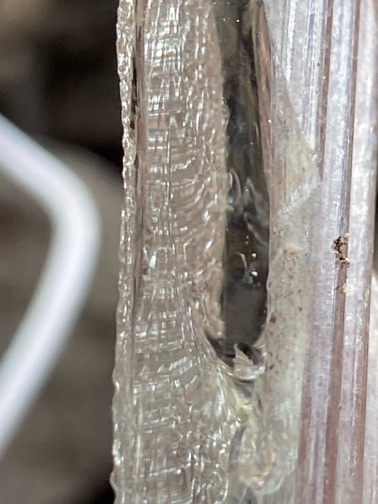 Not a diamond; appears to be industrial resin, textured plastic extrusion, or organic/synthetic resin casting. - Irregular linear/cavity form, not faceted