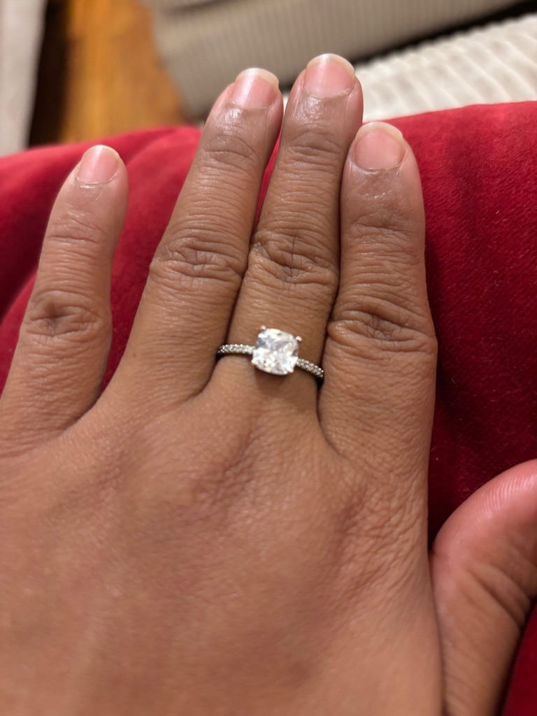 Natural Diamond (Assumed based on visual presentation) - Cushion Modified Brilliant