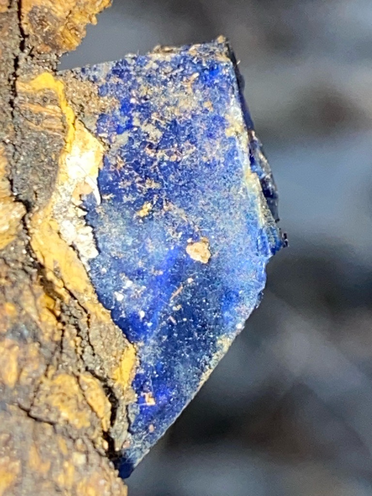 This is not a diamond; it is an opaque blue mineral specimen, likely Lapis Lazuli or Azurite based on the color and host rock. - Rough / Uncut mineral fragment