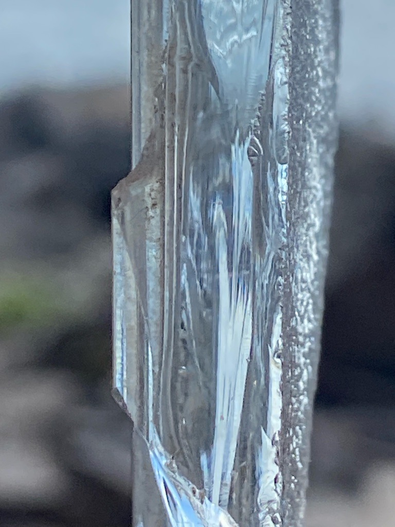 Not a diamond; this is a natural water ice formation or icicle. - N/A - Irregular crystalline column / columnar ice structure