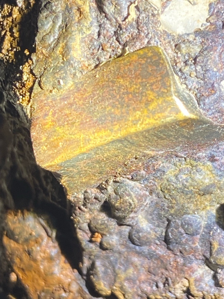 Not a diamond; this image depicts a rough mineral matrix, likely containing iron oxides or weathered rock formations rather than a gemstone diamond. - Irregular raw matrix form