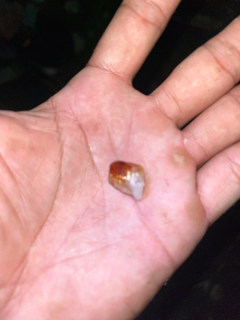 Natural rough stone (appears to be a colored mineral/quartz crystal rather than a genuine diamond) - Rough, uncut, irregular crystal form