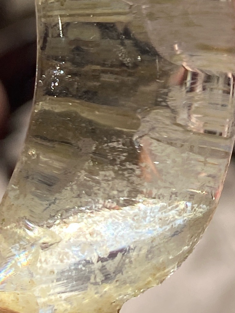 Not a diamond; appears to be quartz crystal, glass, or resin material with internal fractures and inclusions - Rough / unpolished fragment