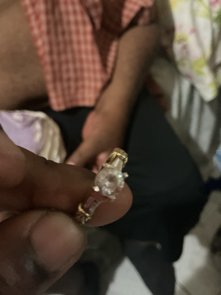 Natural Diamond (Simulant/Cubic Zirconia cannot be fully ruled out visually, but appears consistent with a standard center diamond in a multi-stone setting) - Round Brilliant