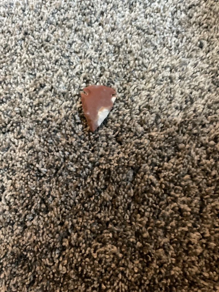 Not a diamond; this is a stone artifact, likely a chert or jasper projectile point. - Arrowhead (Projectile Point)