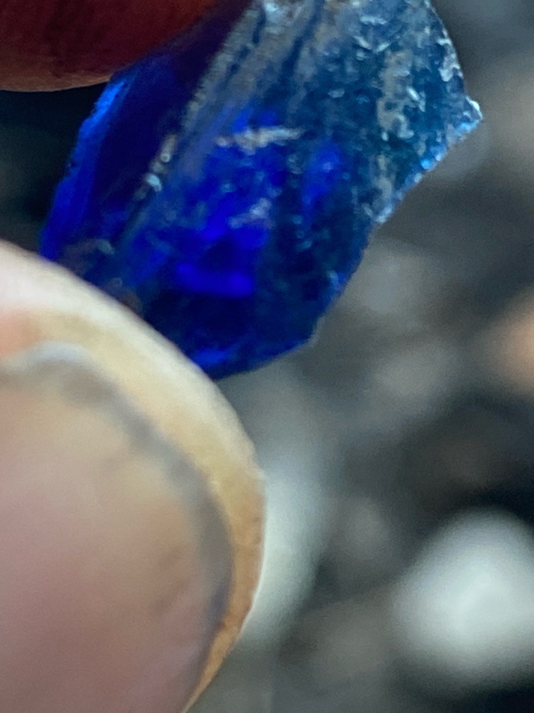 Not a diamond; this specimen appears to be a natural rough blue gemstone, likely sapphire or a similar silicate/oxide mineral given the vivid blue coloration. - Uncut rough crystal, irregular raw formation