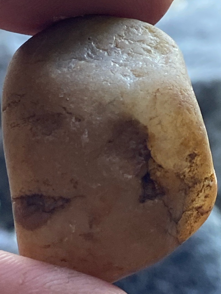 Not a diamond; appears to be a water-worn pebble or quartz/jasper mineral specimen, likely river-worn stone. - Irregular / Rounded Pebble