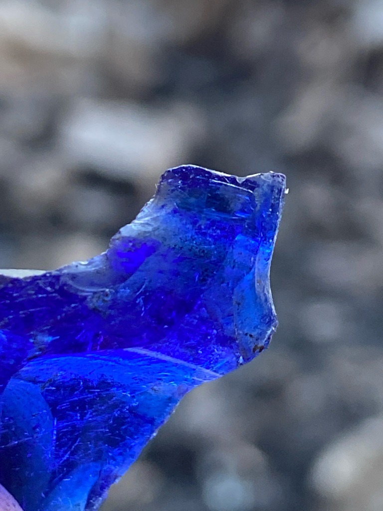 Not a diamond; appears to be a fragment of cobalt blue glass or synthetic material. - Irregular raw fragment / unstructured shard