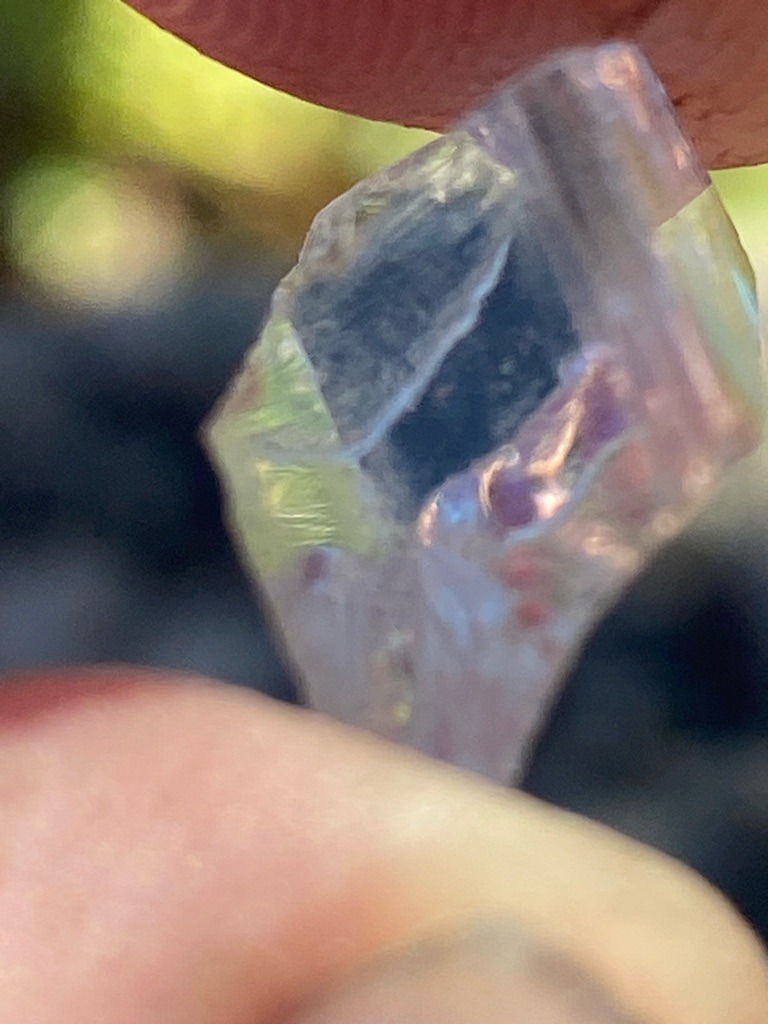 Natural rough diamond or potentially quartz/gem crystal with strong iridescence/coating, assumed diamond-like mineral sample for evaluation - Rough crystal / Irregular uncut crystal form