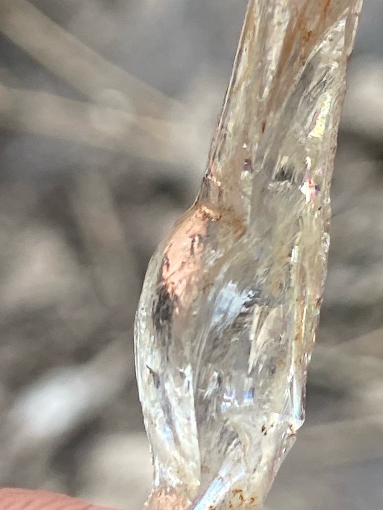 Not a diamond; appears to be raw quartz crystal or natural resin/silicate formation - Rough uncut crystal formation