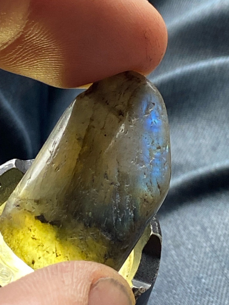 Not a diamond; this is a mineral specimen, specifically Labradorite (feldspar mineral displaying labradorescence). - Tumbled, partially polished freeform / irregular cabochon.