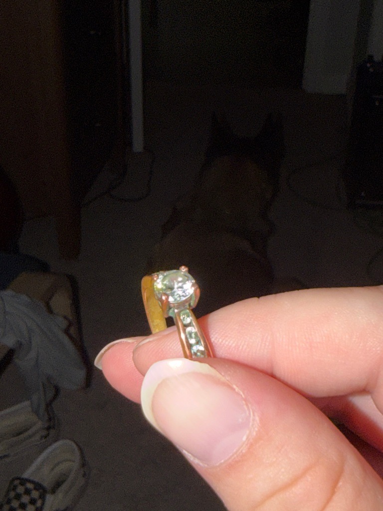 Moissanite or Cubic Zirconia (indicated by strong orange/rainbow flash under camera light dispersion) - Round Brilliant