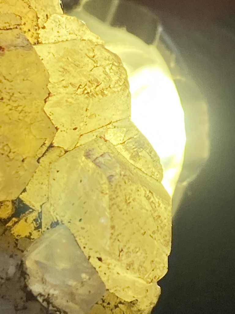 The image shows a raw mineral specimen, likely yellow sulfur crystals or another yellow mineral formation, rather than a polished diamond. Therefore, standard diamond grading metrics do not apply directly to this specimen. - Natural rough mineral crystal form, not a standard faceted diamond shape.