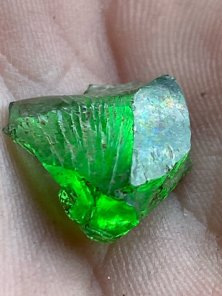 Not a diamond; appears to be a rough green crystal, possibly tsavorite garnet, chrome tourmaline, or a synthetic green glass/quartz material. - Rough crystal / Uncut natural form with crystalline striations