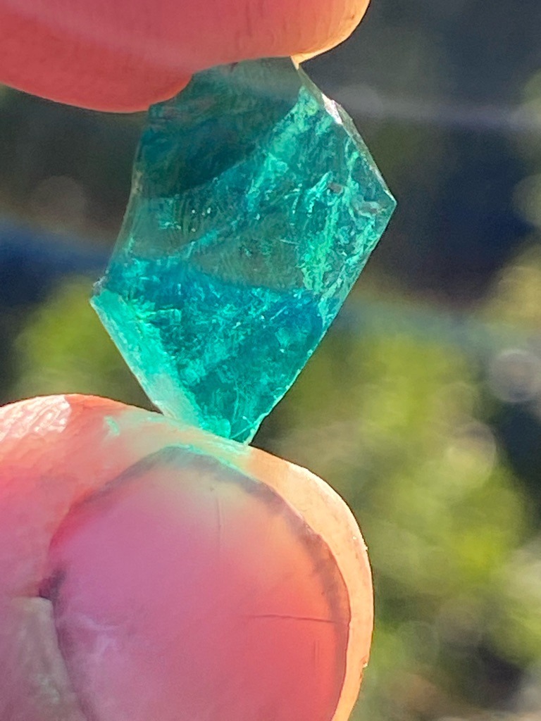 Not a diamond; appears to be raw colored glass or quartz/slag material, commonly misrepresented as a diamond or rough gemstone. - Rough crystal / Raw irregular shape