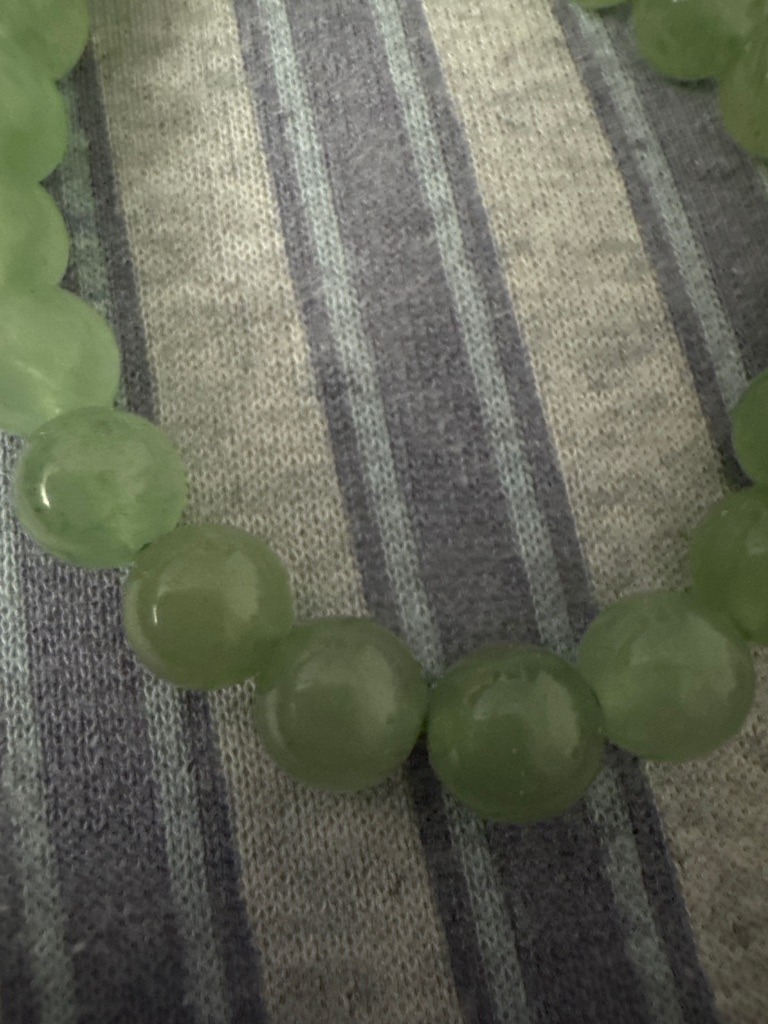 Not a diamond; these are green gemstone beads, likely Jadeite Jade or Aventurine. - Spherical bead cut