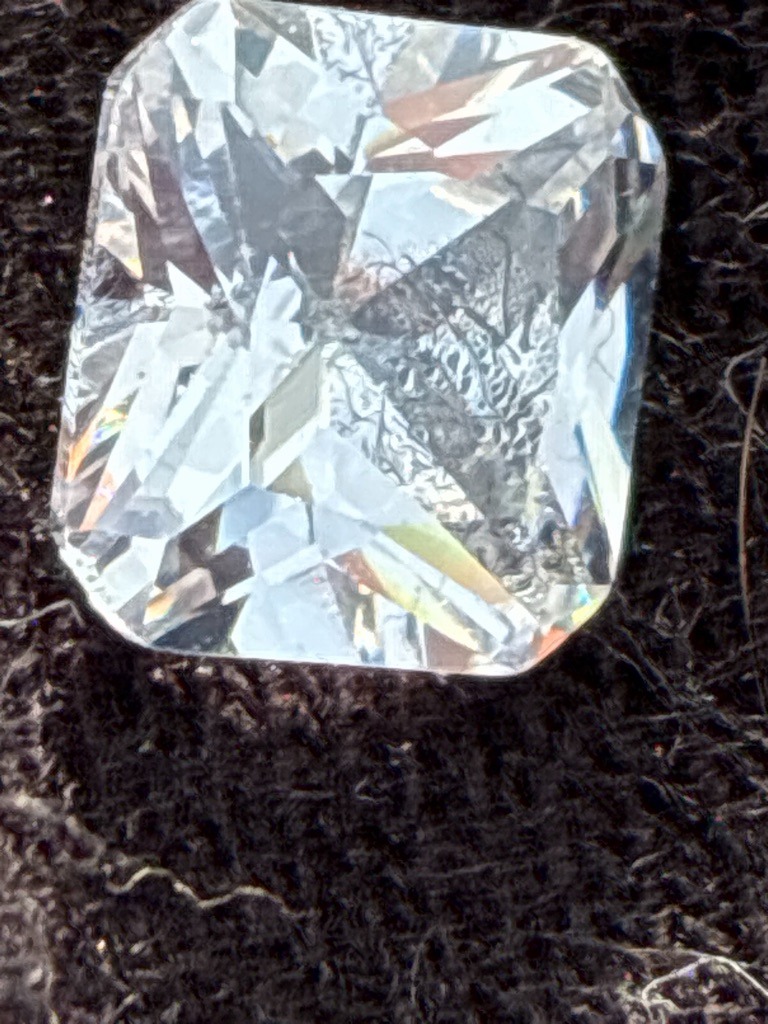 Natural Diamond (Probable, based on facet wear and inclusions) - Radiant Cut (Square Modified Brilliant)