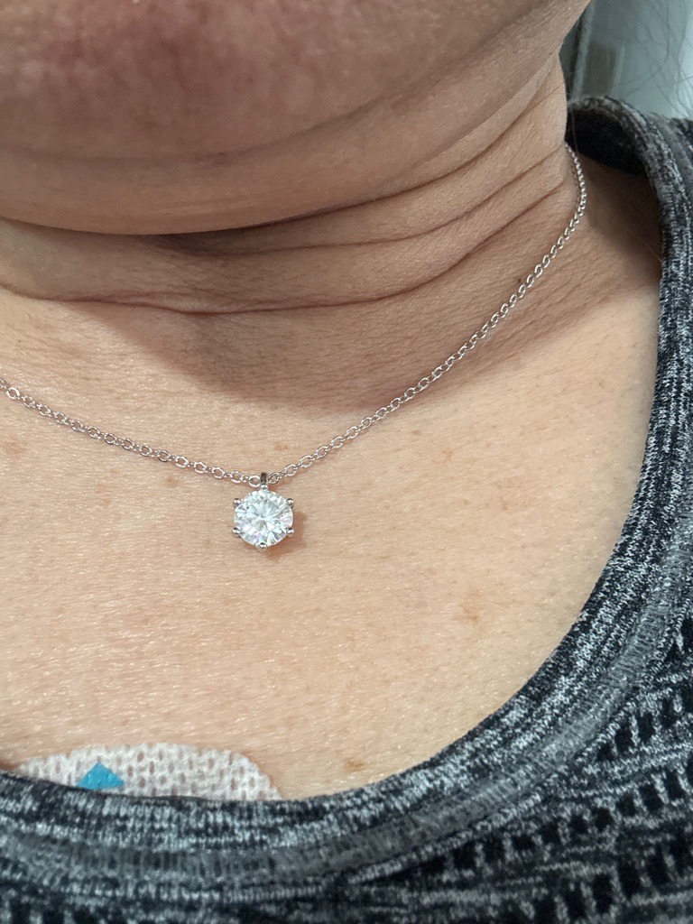 Natural Diamond (Simulated visual assessment indicates standard gemstone characteristics, likely natural or lab-grown diamond) - Round Brilliant
