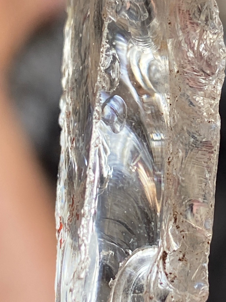 Not a diamond; this specimen appears to be industrial slag glass or raw quartz crystal showing conchoidal fracture patterns characteristic of glass rather than crystalline diamond growth. - Irregular raw chunk / rough fragment with conchoidal fractures
