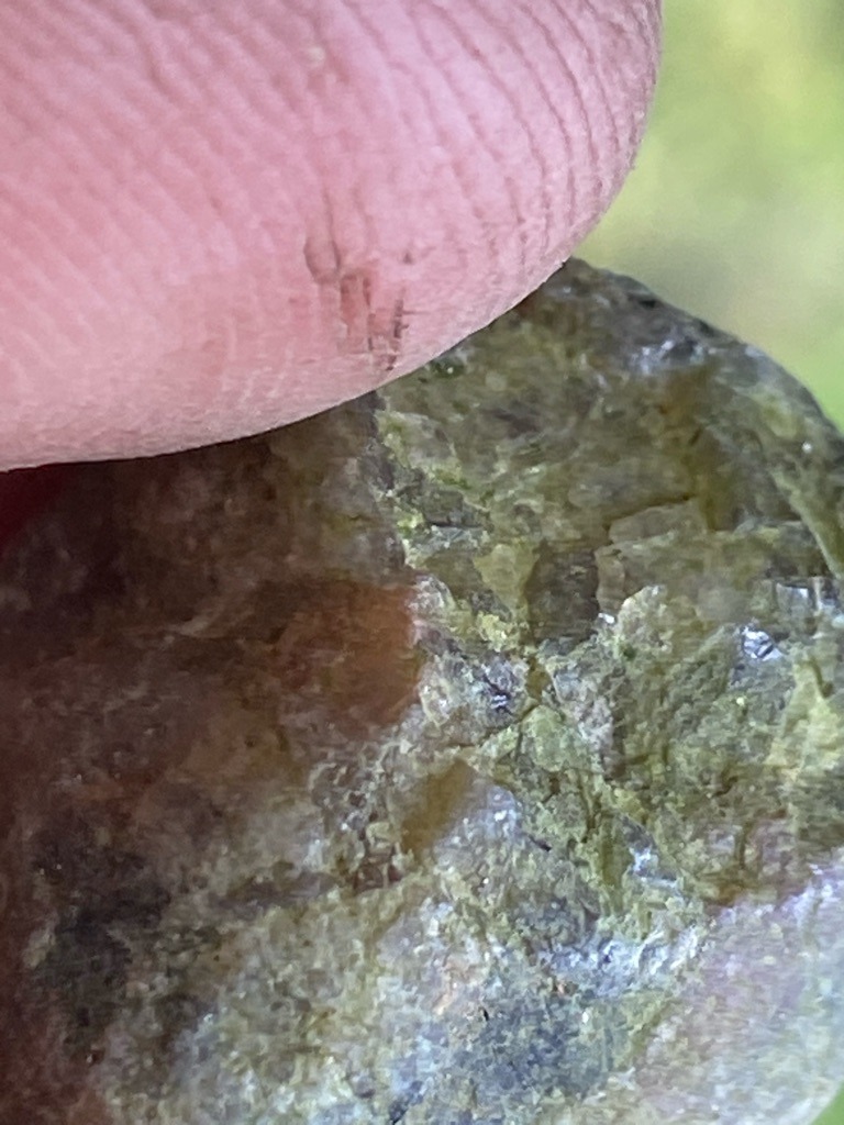 Not a diamond; appears to be a rough mineral specimen, possibly peridot, olivine, or altered silicate rock, lacking gem-grade diamond crystal habits. - Irregular rough specimen, unpolished and uncut
