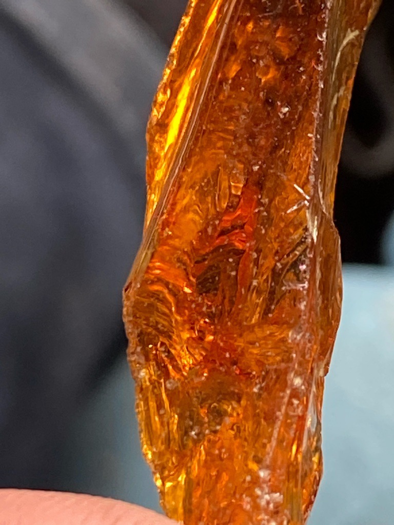 Not a diamond; appears to be raw amber or resin material. - Rough uncut organic chunk / irregular shape