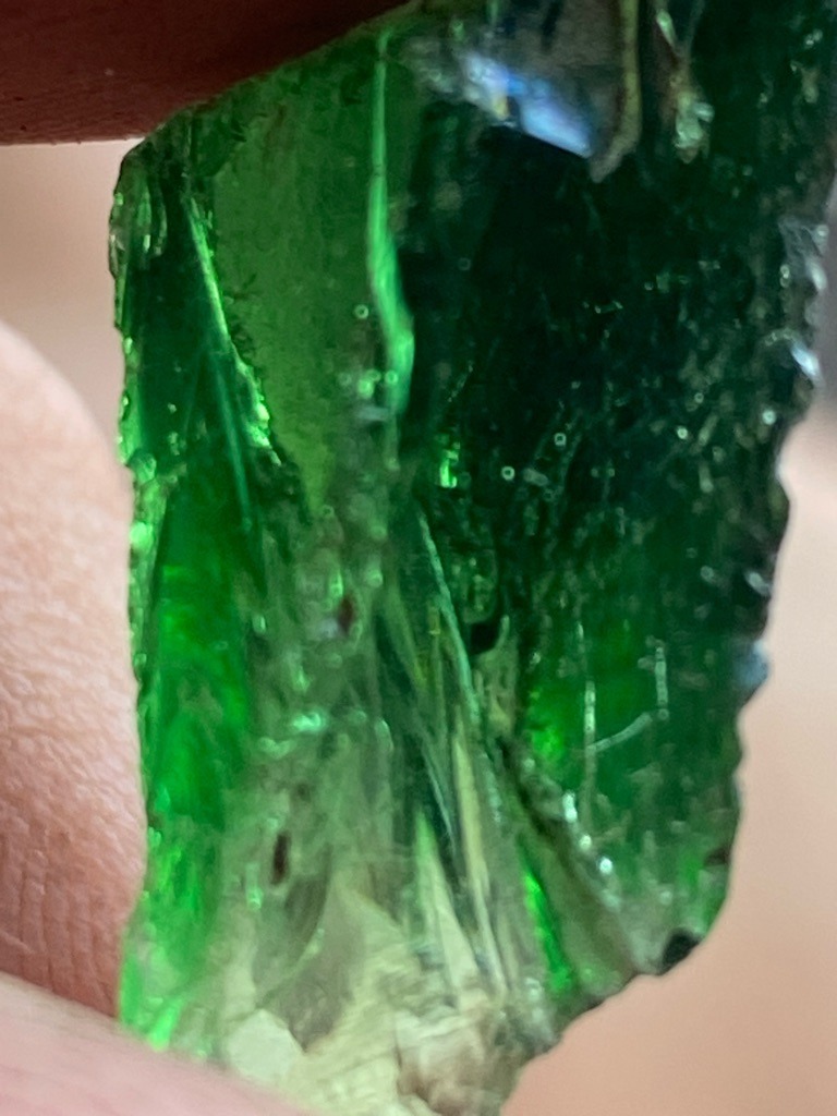 Not a diamond; this specimen appears to be green glass or synthetic slag, displaying characteristic curved striae and gas bubbles. - Raw, unpolished, irregular fragment or chunk