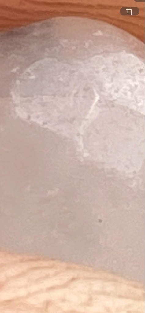 Unable to definitively determine from the provided image, as the visual data is extremely blurry and shows no distinct gemstone facets. - Undetermined / Indiscernible due to image blur and lack of visible outline.