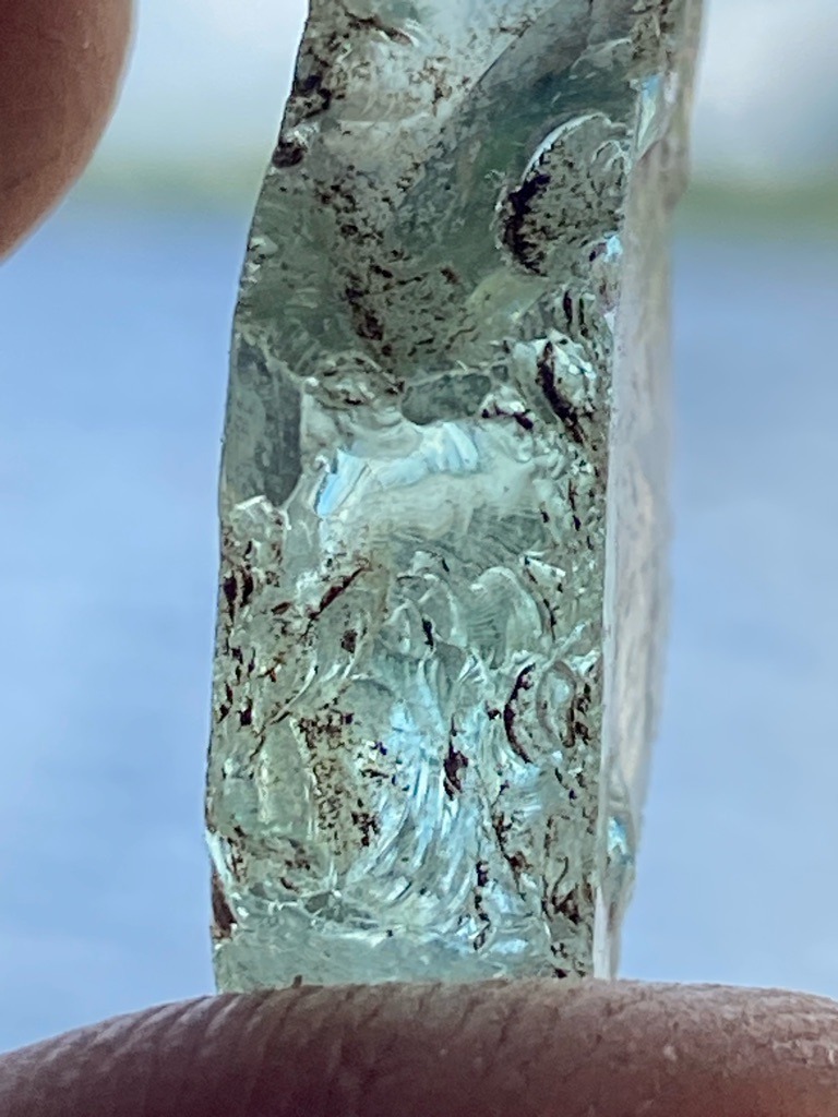 Not a diamond; appears to be industrial slag glass, quartz, or unpolished mineral matrix with carved relief or natural irregular etching. - Uncut / Raw Mineral Specimen with Carved Intaglio or Relief