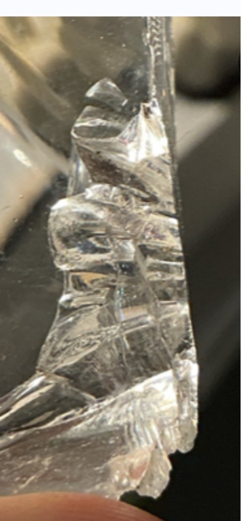 Not a diamond; appears to be raw or broken glass/quartz material - Irregular / Raw fragment