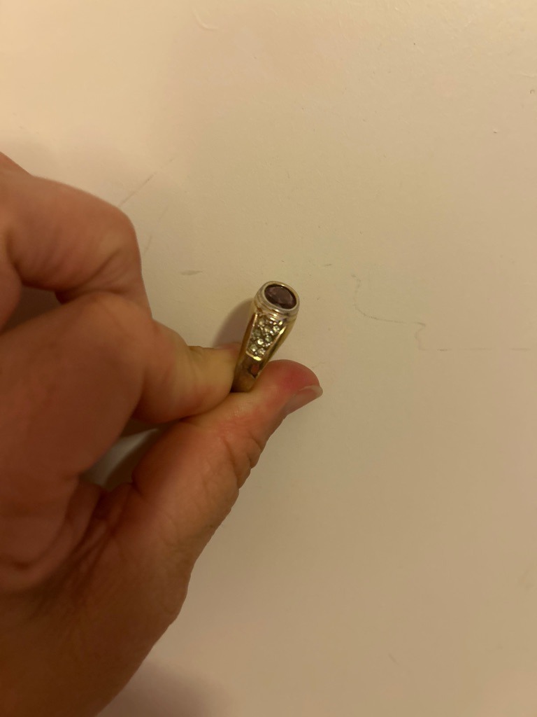 Natural (accent diamonds on the ring shoulders), central gemstone appears to be a purple stone such as amethyst or tourmaline - Round (accent stones) and Oval (central gemstone)