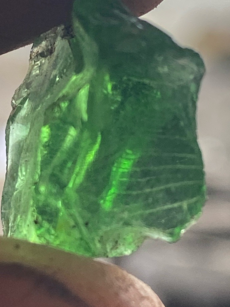 Not a diamond; this specimen appears to be green glass or a green mineral crystal (such as rough emerald or tourmaline) rather than a diamond. - Raw, uncut, amorphous rough crystal/fragment