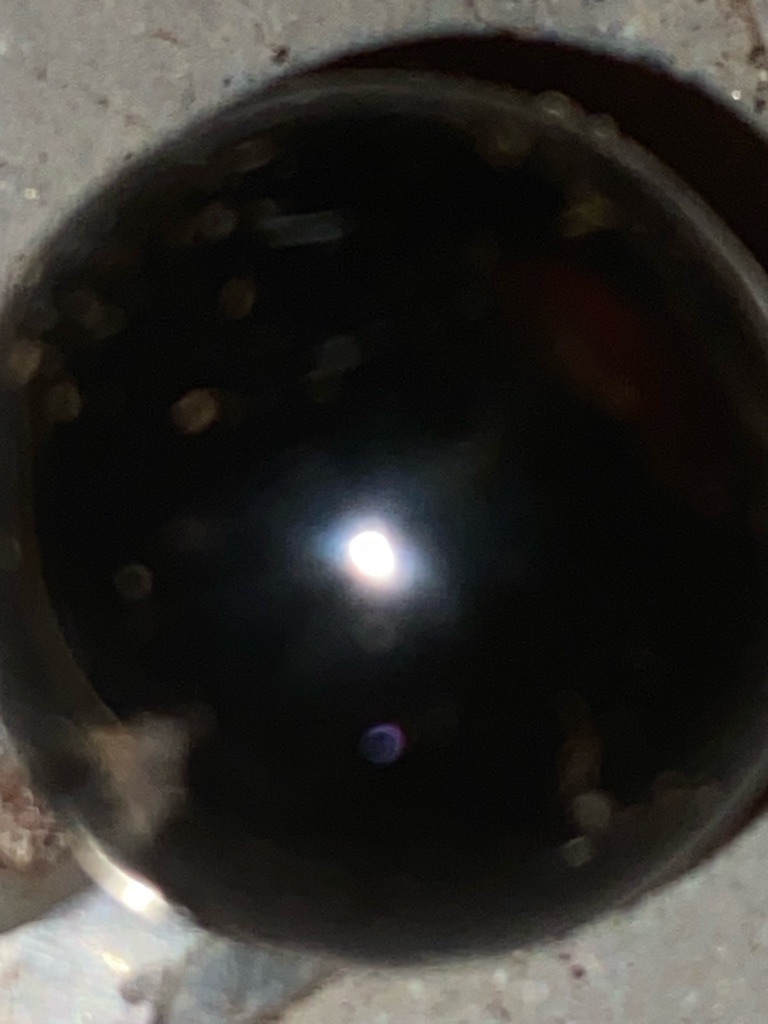 The provided image is too dark, blurry, and lacks the necessary facet details to perform a reliable gemological analysis or confirm whether it is a natural diamond, lab-grown diamond, or diamond simulant. - Indeterminate due to poor lighting and lack of visible outline.