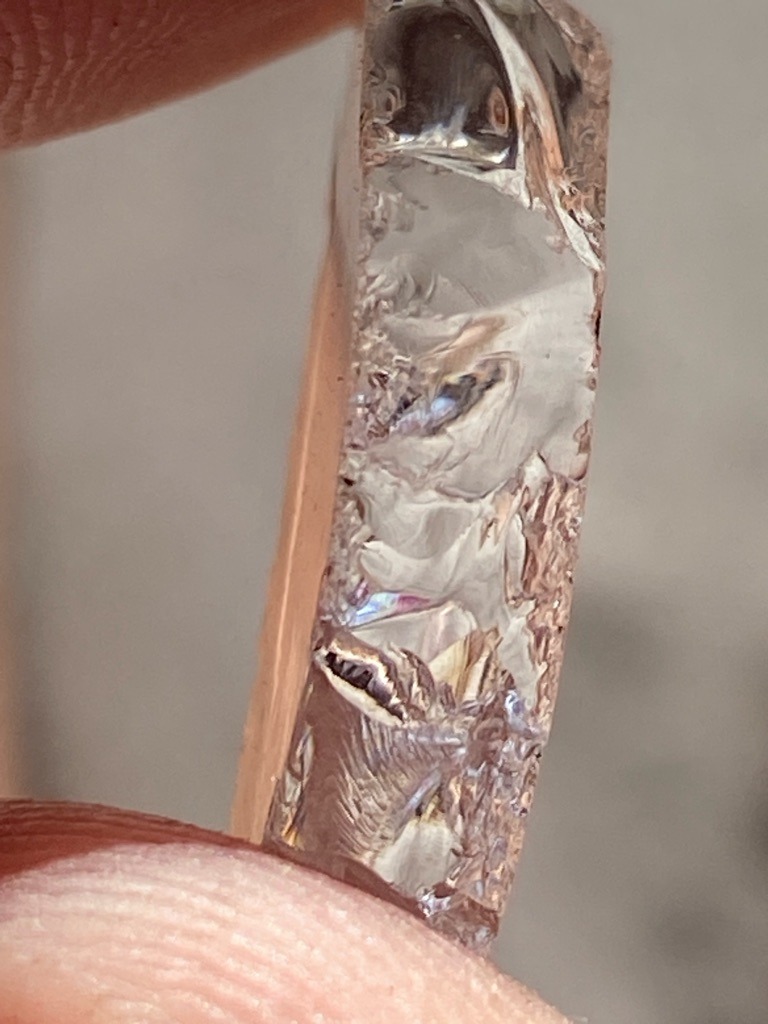 Not a diamond; appears to be raw silicon, industrial slag, or a synthetic silicon wafer fragment exhibiting characteristic metallic luster and conchoidal fracture. - Irregular raw bar or fragment with unfinished, fractured edges.