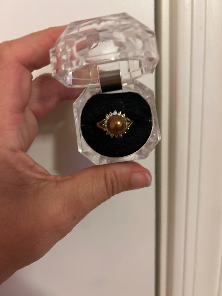 Not a diamond; the central gem is a cultured pearl (likely golden South Sea or Tahitian dyed/treated), surrounded by small accent melee diamonds. - Round (Pearl is round/spherical; surrounding accent diamonds are round brilliant).