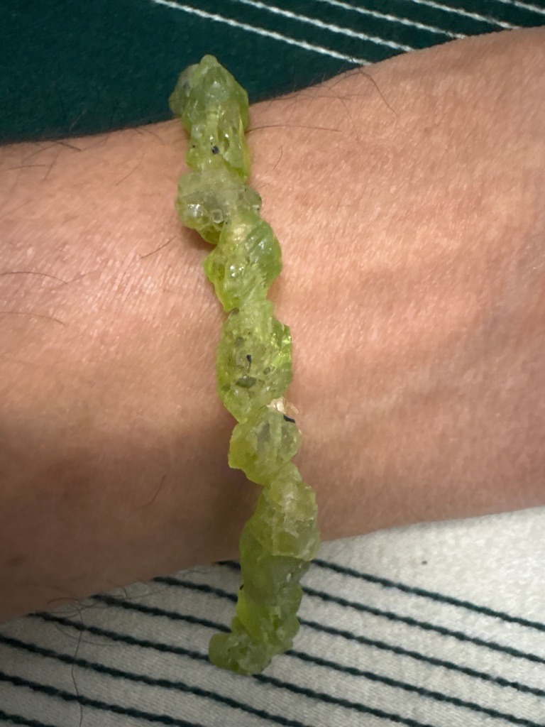 Not a diamond; these are raw, unpolished green stones, likely Peridot (olivine) or a similar green mineral crystal, commonly used in beaded bracelets. - Rough crystal / Nugget / Raw beads