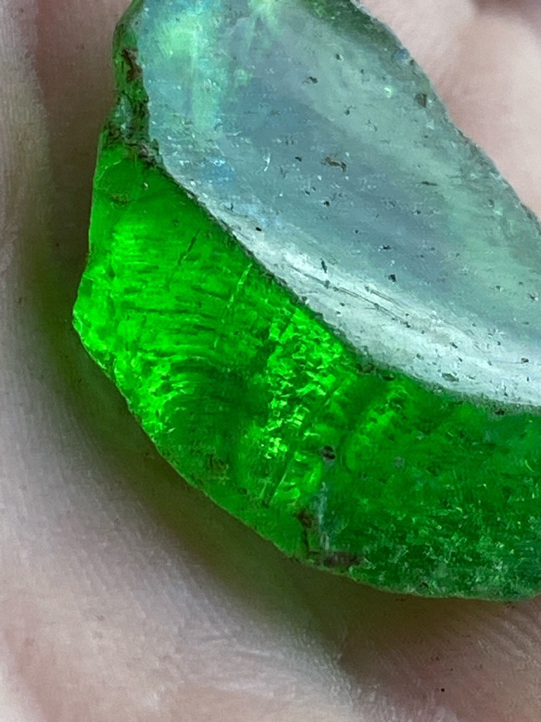 Not a diamond; this specimen appears to be green glass or slag material exhibiting conchoidal fracture and internal bubbles, completely distinct from crystalline diamond. - Rough/Raw broken chunk with irregular, conchoidal fracture surfaces.