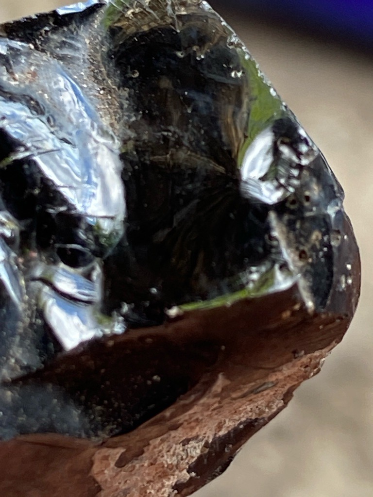 Not a diamond; this appears to be industrial slag glass, obsidian, or a similar vitreous material displaying characteristic conchoidal fracture and gas bubbles. - Rough / Uncut irregular chunk with conchoidal fracture surfaces