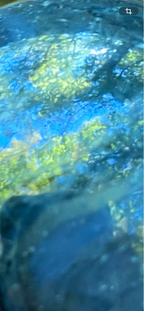 Unable to verify conclusively as a diamond from the provided image, which appears to show a heavily magnified, blurred, or distorted surface with strong iridescent or reflective interference. - Not determinable from the provided image.