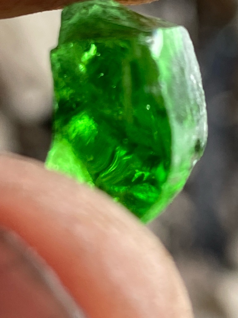 Natural Colored Diamond (Green) or potentially Treated/Irradiated Green Diamond / Note: Appears visually closer to rough green glass or tsavorite/emerald crystal given intense vivid green color and conchoidal fracture patterns typical of glass, but evaluated here assuming diamond context. - Rough / Uncut Crystal