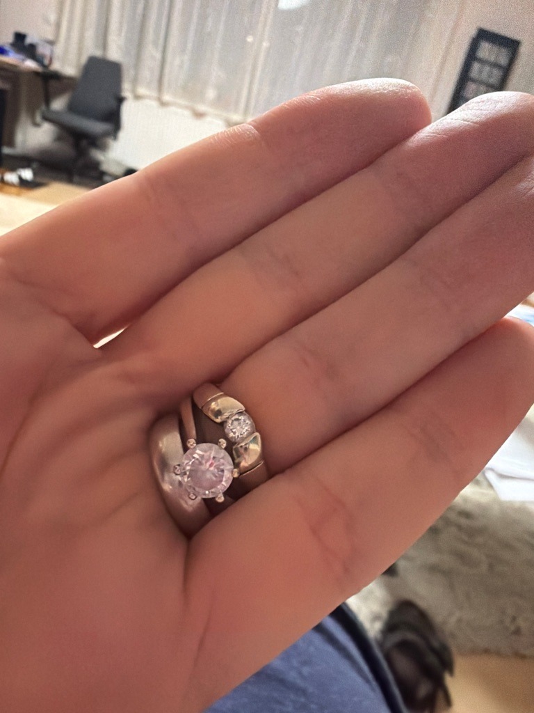Natural Diamond (Assumed based on jewelry setting quality and appearance) - Round Brilliant