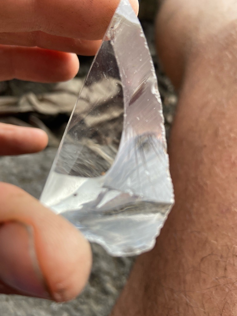 Not a diamond; appears to be raw quartz crystal or glass slag due to conchoidal fracture patterns and lack of standard diamond crystal habit. - Irregular / Raw fragment