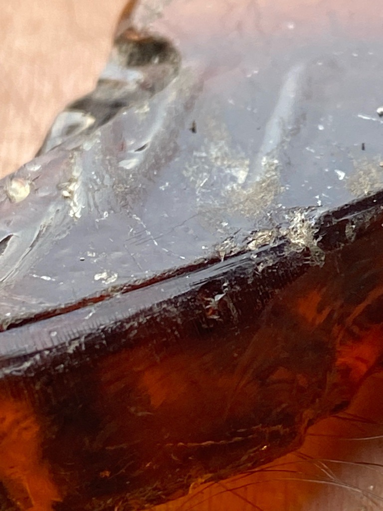 Not a diamond; this specimen appears to be amber or a heavily weathered, resinous organic material rather than crystalline carbon. - Irregular / Raw natural nodule fragment