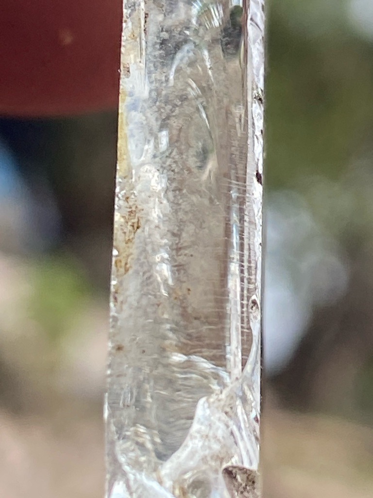 Natural rough crystal / mineral specimen, likely quartz or a heavily included crystal rather than a gem-grade diamond based on the striations and habit visible - Rough elongated crystal (unfaceted raw specimen)