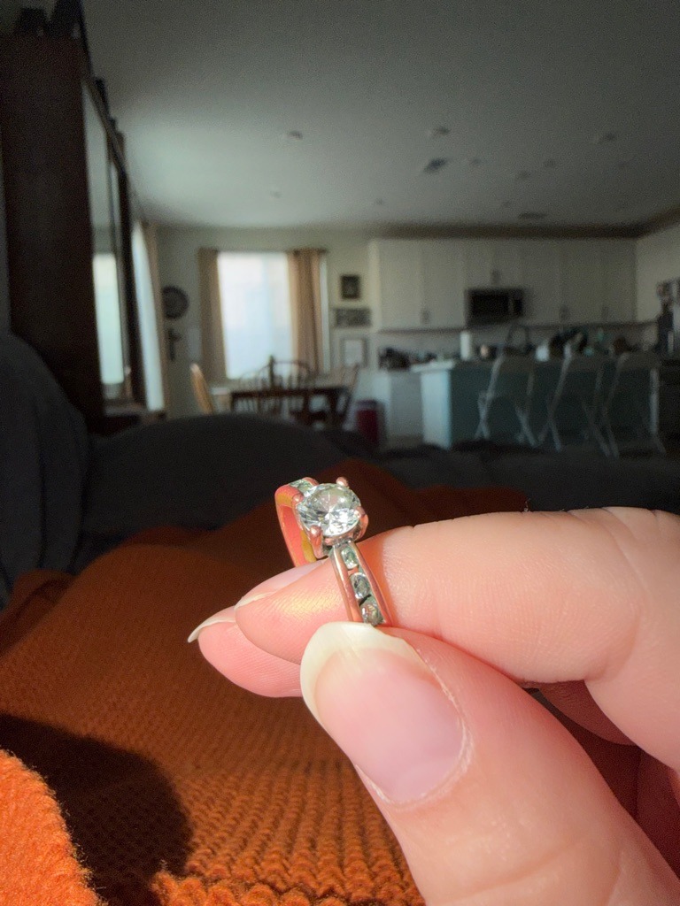 Natural Diamond (Assumed based on visual context, though lab-grown cannot be ruled out without spectroscopic testing) - Round Brilliant