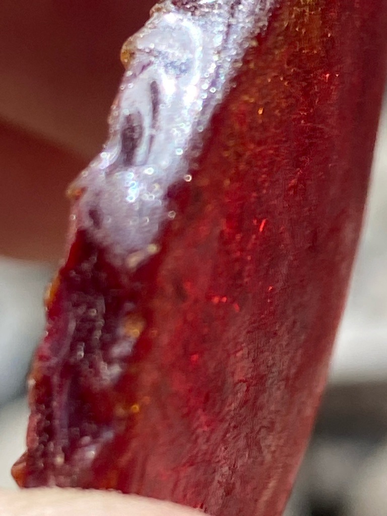 Not a diamond (appears to be a mineral fragment, resin, or aggregate material) - Irregular raw fragment