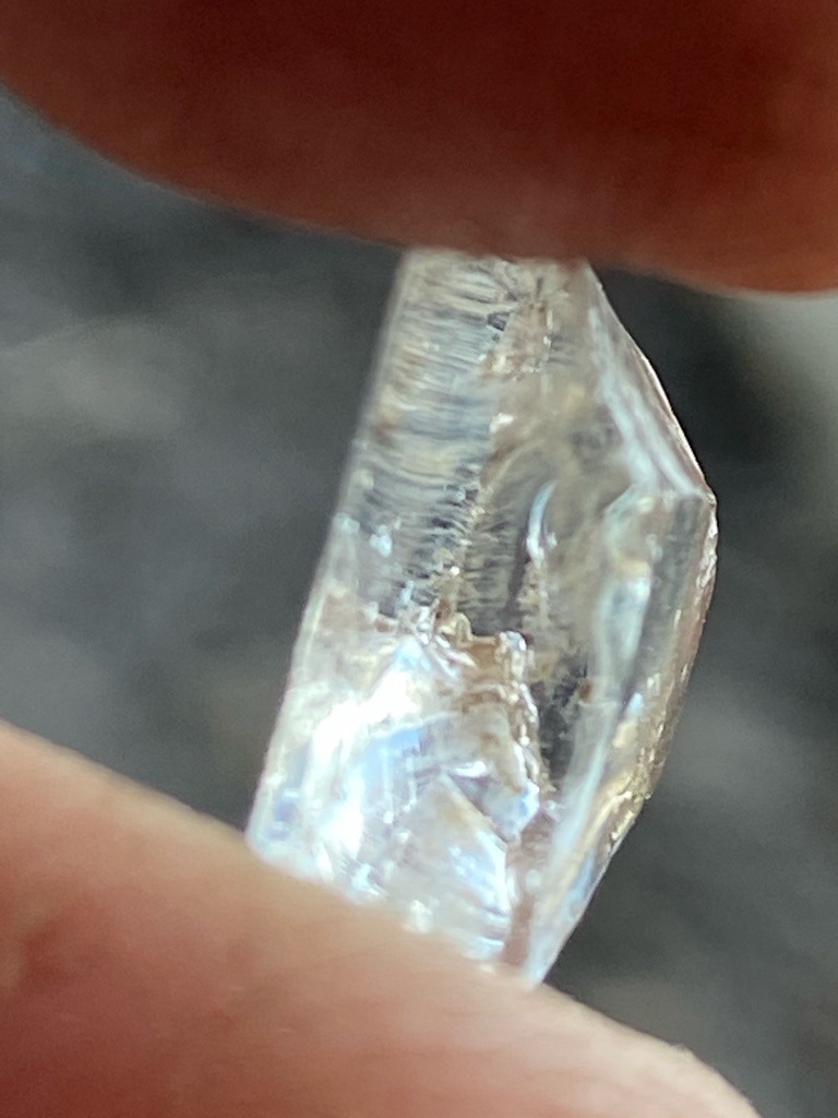 Natural rough diamond crystal showing distinct trigons and growth lines - Rough crystal / Uncut octahedral or macle fragment