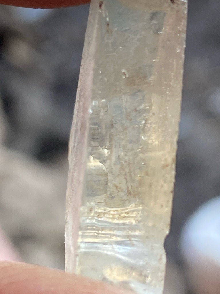 Natural rough crystal (likely Quartz or Beryl based on prismatic habit and striations, though evaluated as a raw mineral sample) - Rough crystal, uncut elongated prism